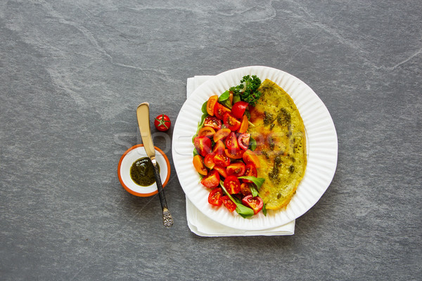 Omelette with arugula and tomatoes salad Stock photo © YuliyaGontar