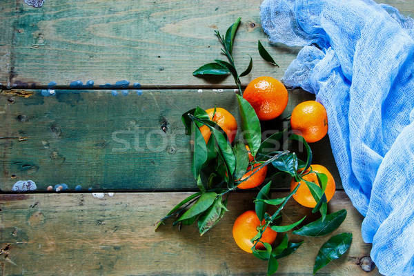 Tangerines green leaves Stock photo © YuliyaGontar