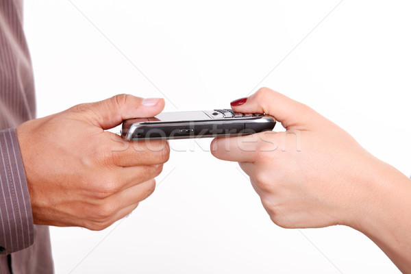 Cellulare mani donna pda isolato bianco Foto d'archivio © yupiramos