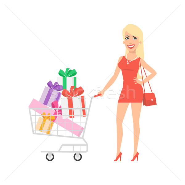 Girl standing with cart and gifts Stock photo © yuriytsirkunov