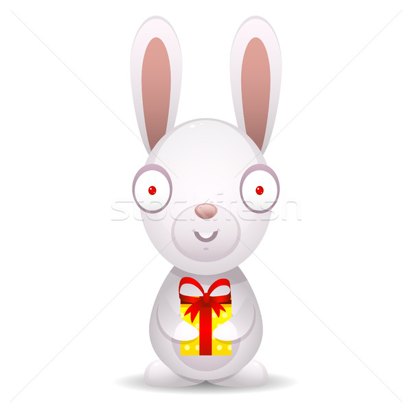 Rabbit holds packed gift Stock photo © yuriytsirkunov