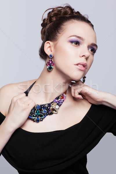 Mulher jovem bijuteria cinza vestido preto mão moda Foto stock © zastavkin
