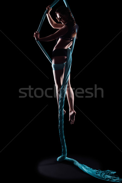 Young woman gymnast with blue gymnastic ribbon Stock photo © zastavkin