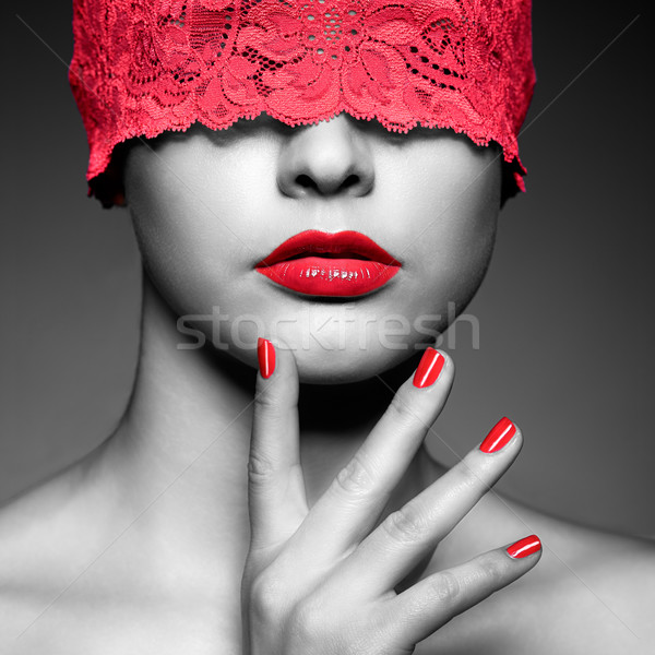woman with red lacy ribbon on eyes Stock photo © zastavkin