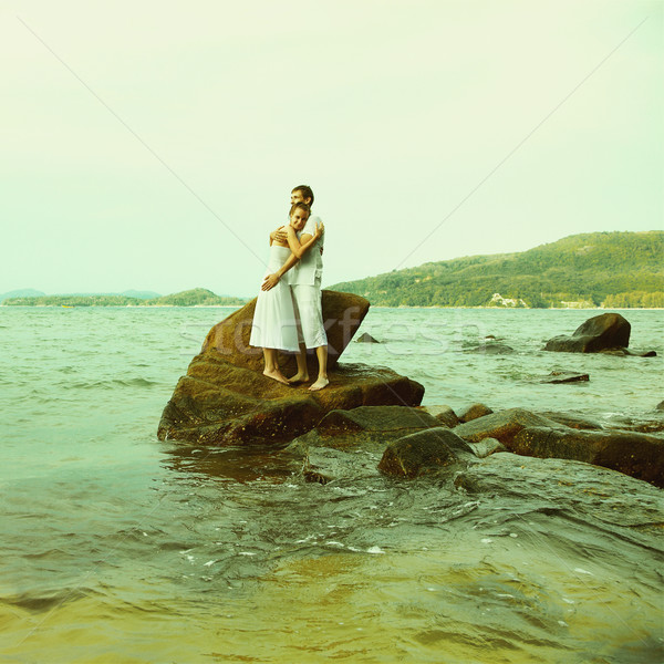 Instagram colorized vintage couple on beach portrait  Stock photo © zastavkin