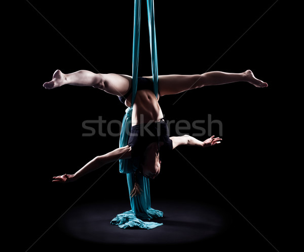 Young woman gymnast with blue gymnastic ribbon Stock photo © zastavkin