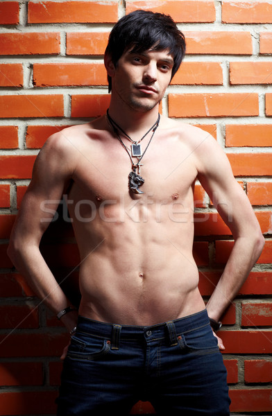 man near brick wall Stock photo © zastavkin