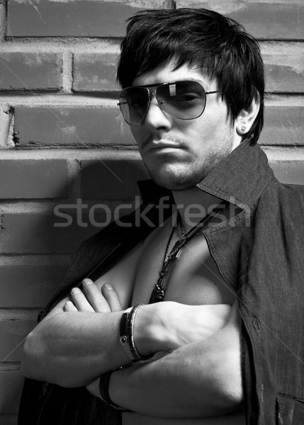 man near brick wall Stock photo © zastavkin