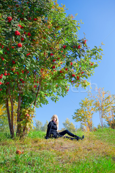 Woman under mountain ash tree Stock photo © zastavkin
