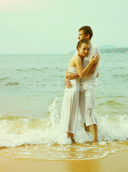 Instagram colorized vintage couple on beach portrait  Stock photo © zastavkin