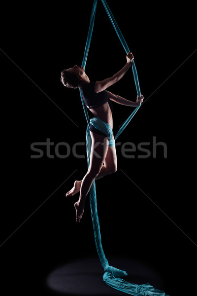 Young woman gymnast with blue gymnastic ribbon Stock photo © zastavkin