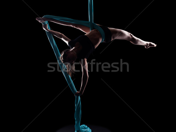 Young woman gymnast with blue gymnastic ribbon Stock photo © zastavkin