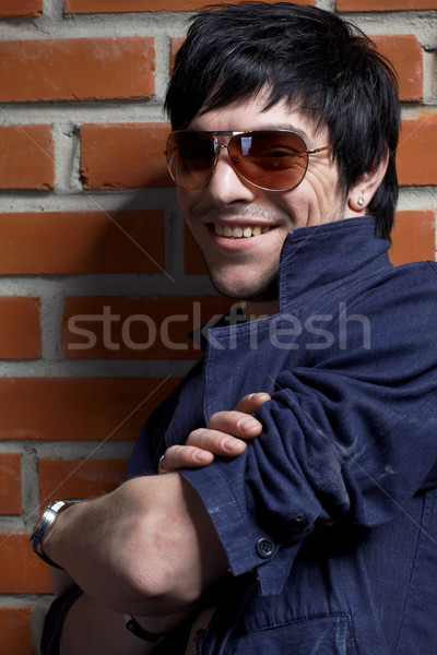Adam tuğla duvar portre genç poz duvar Stok fotoğraf © zastavkin