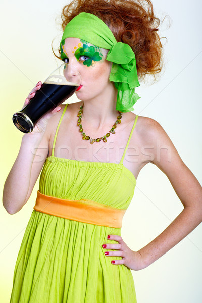 red-haired girl drinking stout Stock photo © zastavkin