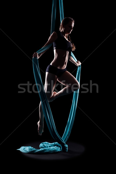 Young woman gymnast with blue gymnastic ribbon Stock photo © zastavkin
