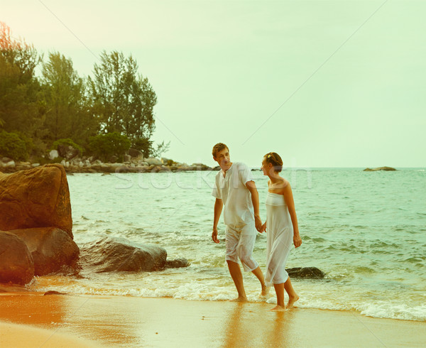 Instagram colorized vintage couple on beach portrait Stock photo © zastavkin