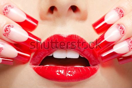 young woman biting rose Stock photo © zastavkin