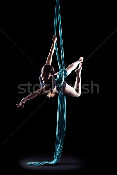 Young woman gymnast with blue gymnastic ribbon Stock photo © zastavkin