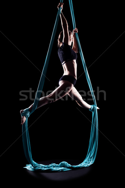 Young woman gymnast with blue gymnastic ribbon Stock photo © zastavkin