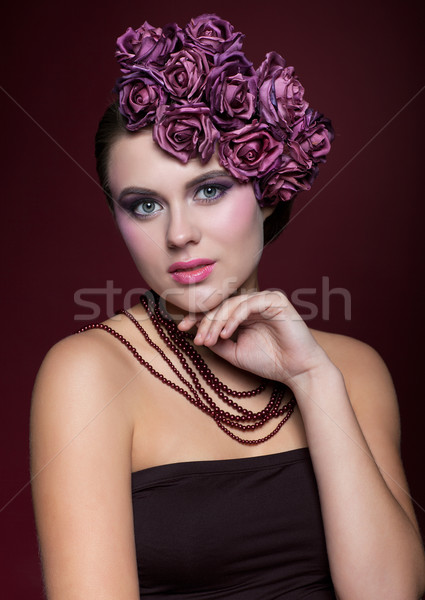 Beautiful young woman with artificial rouses on head necklace an Stock photo © zastavkin
