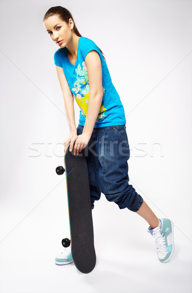 Stock photo: girl with skateboard