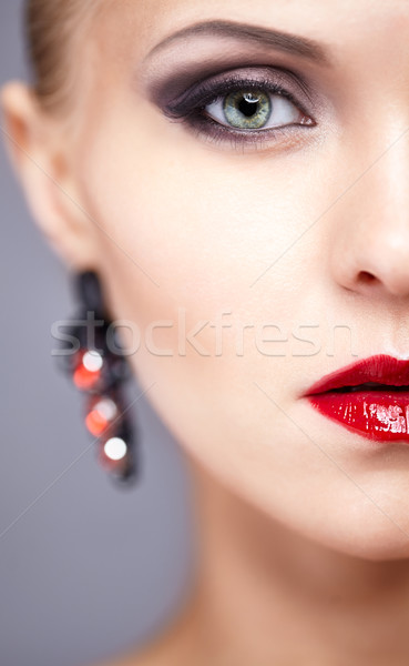 Half face close-up portrait of young woman Stock photo © zastavkin