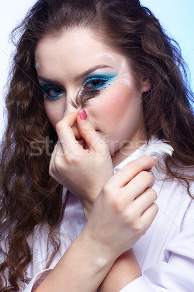 beautiful girl with feather Stock photo © zastavkin