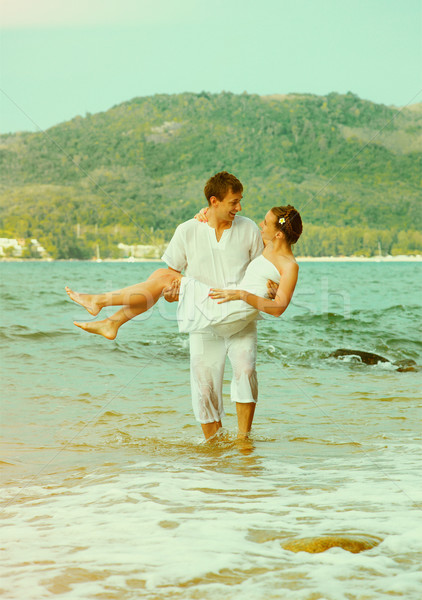 Instagram colorized vintage couple on beach portrait Stock photo © zastavkin