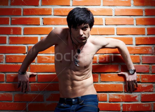 man near brick wall Stock photo © zastavkin