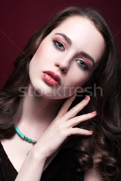 Young beautiful woman in black dress with green pistachio colour Stock photo © zastavkin