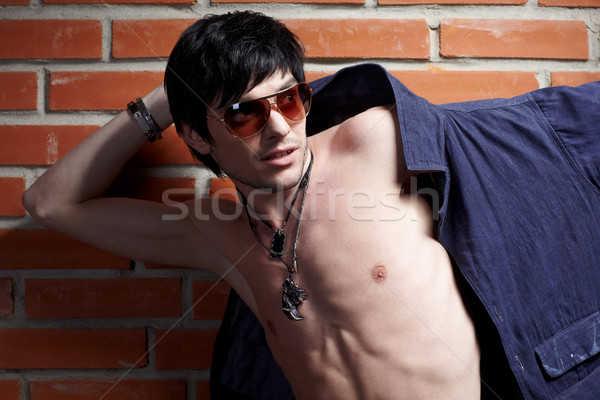 man near brick wall Stock photo © zastavkin