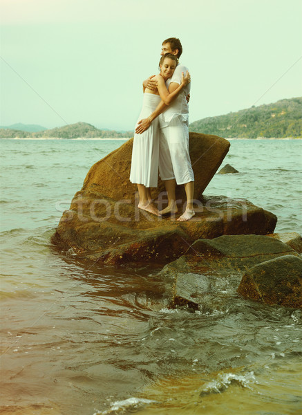 Instagram colorized vintage couple on beach portrait  Stock photo © zastavkin