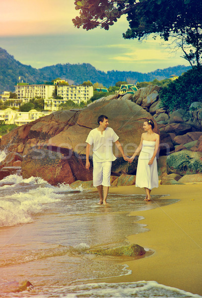 Instagram colorized vintage couple on beach portrait Stock photo © zastavkin