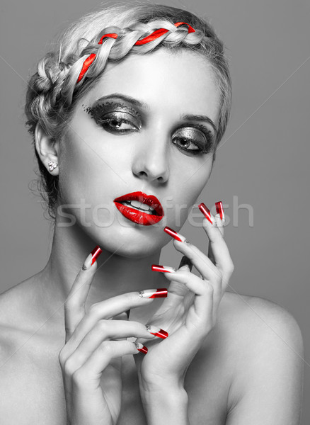 Stock photo: Young woman with red nails