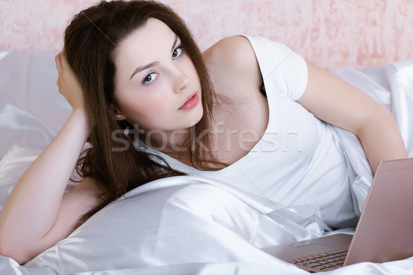 relaxing girl with laptop Stock photo © zastavkin