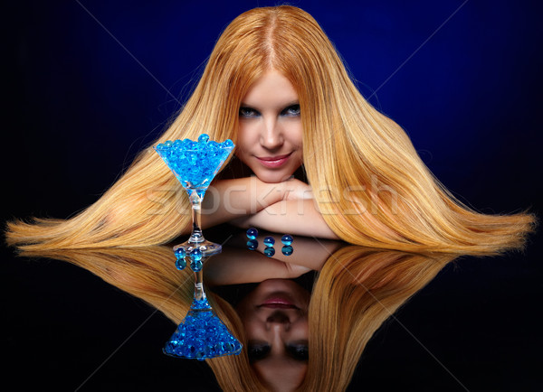 beautiful redhead girl with blue gel balls Stock photo © zastavkin