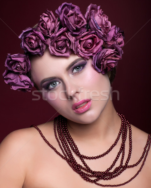 Beautiful young woman with artificial rouses on head necklace on Stock photo © zastavkin
