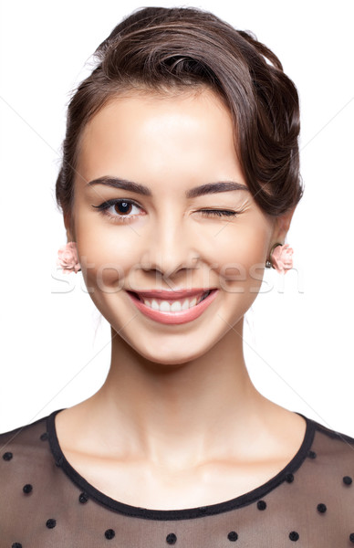 Young woman give a wink Stock photo © zastavkin