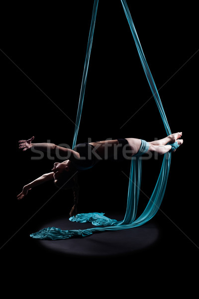 Young woman gymnast with blue gymnastic ribbon Stock photo © zastavkin