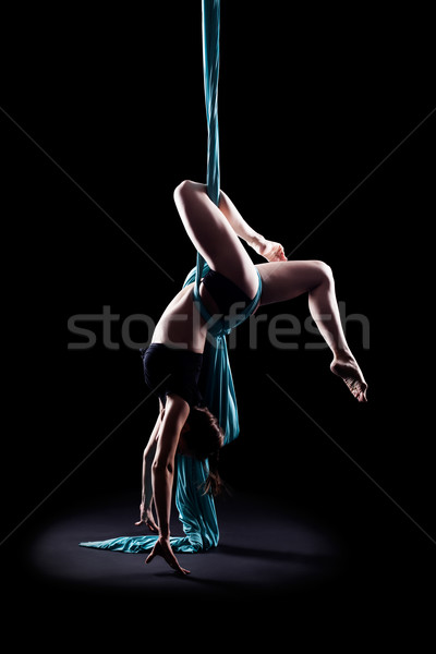 Young woman gymnast with blue gymnastic ribbon Stock photo © zastavkin