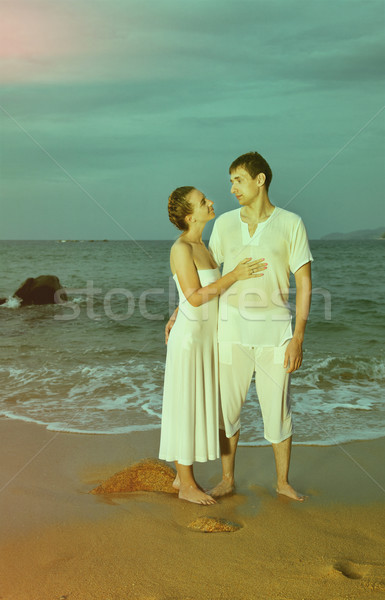 Instagram colorized vintage couple on beach portrait Stock photo © zastavkin