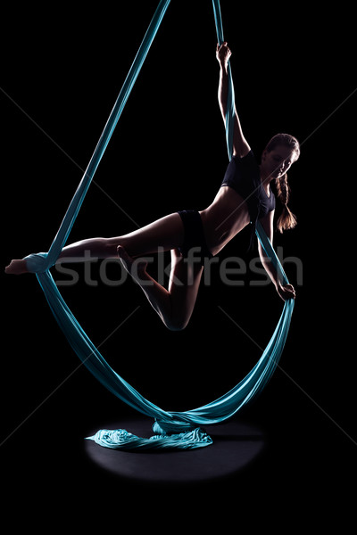 Young woman gymnast with blue gymnastic ribbon Stock photo © zastavkin