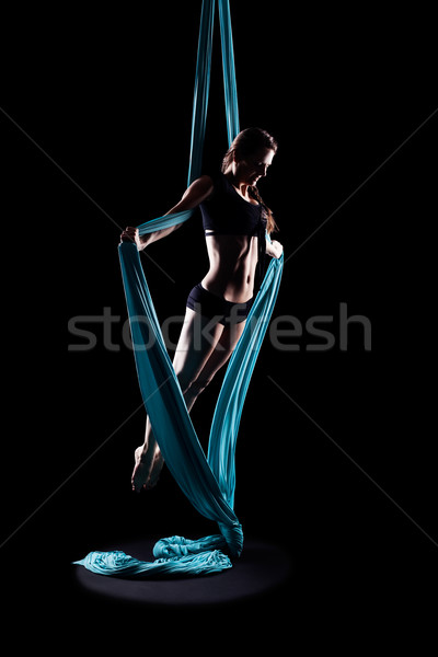 Young woman gymnast with blue gymnastic ribbon Stock photo © zastavkin
