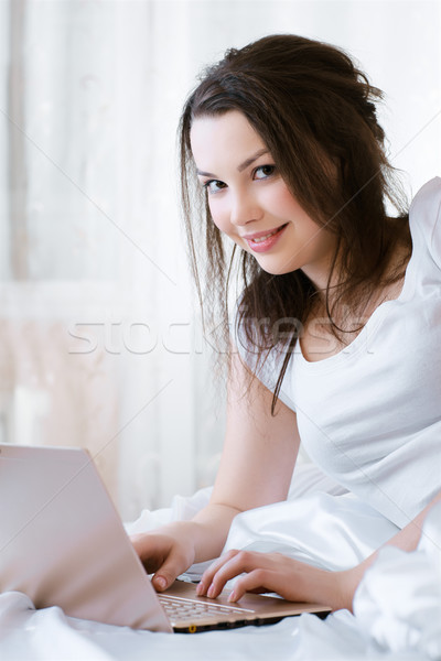 relaxing girl with laptop Stock photo © zastavkin