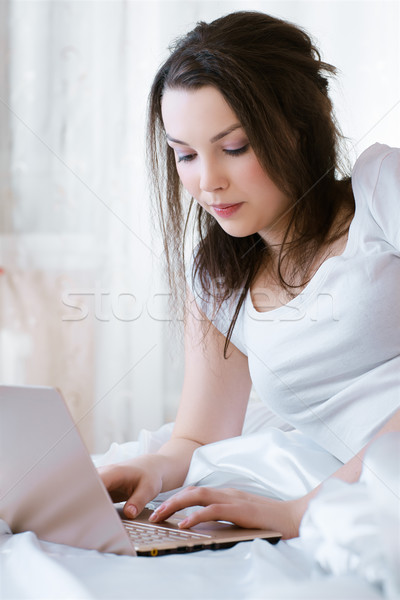 relaxing girl with laptop Stock photo © zastavkin