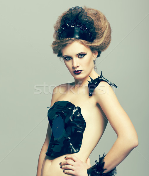 Woman in dress of molten vinyl disk Stock photo © zastavkin