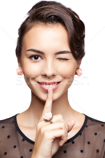 Young woman give a wink Stock photo © zastavkin