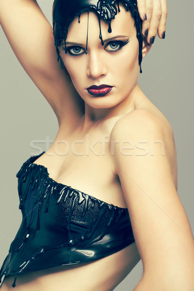 Woman in dress of molten vinyl disk Stock photo © zastavkin