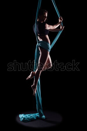 Young woman gymnast with blue gymnastic ribbon Stock photo © zastavkin