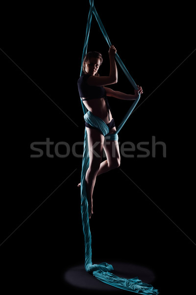 Young woman gymnast with blue gymnastic ribbon Stock photo © zastavkin